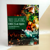 <img src=”Houston-Posters-Printing.jpg” alt=”Custom Posters with Lamination with Christmas decoration image on the background and "TREE LIGHTING" text in center right side”>