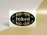 <img src=”Individual-5x3-Custom-Oval-Sticker.jpg” alt=”Custom Oval Stickers with black color and flower on the background and "Inked" text in center”>